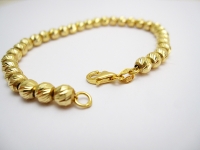 צמיד זהב כדורים מבריקים